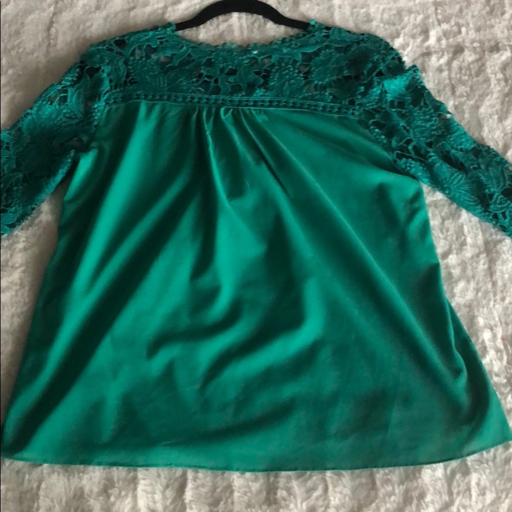 A green open flower long sleeve blouse.